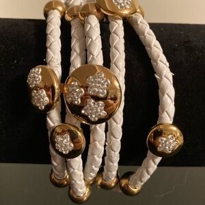 White braided cord bracelet with magnetic clasp and sparkly golden rhinestones